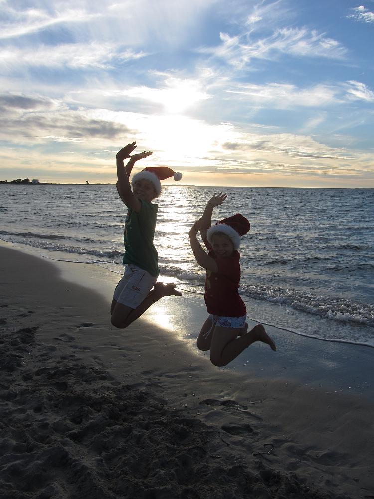 Jumping Santas at the beach